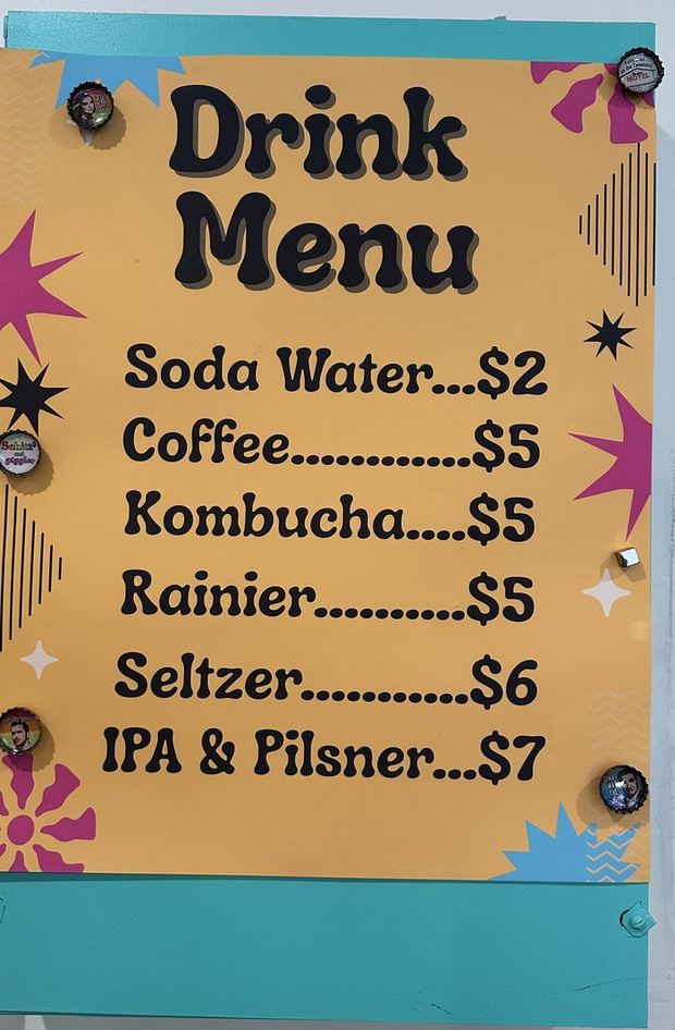 The hand-lettered drink menu: soda water $2, coffee $5, kombucha $5, Rainier $5, seltzer $6, IPA and pilsner $7
