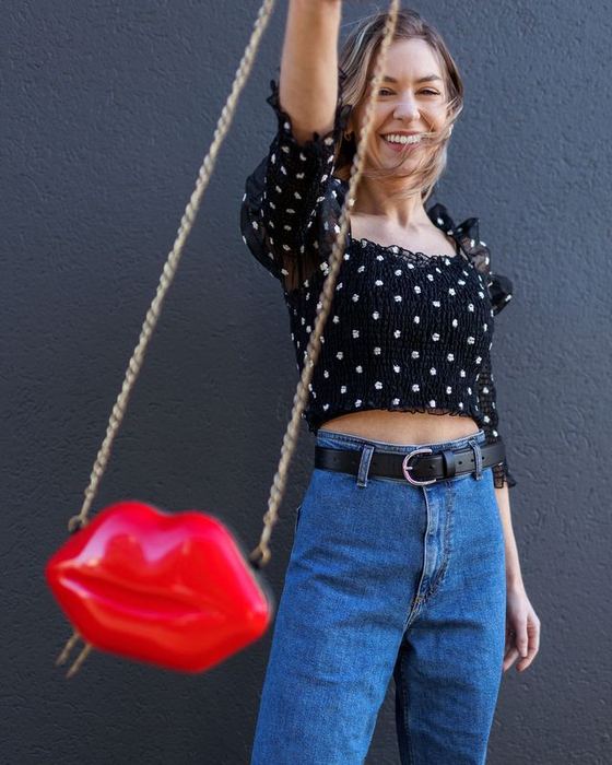 A polka-dot top with a red lips purse